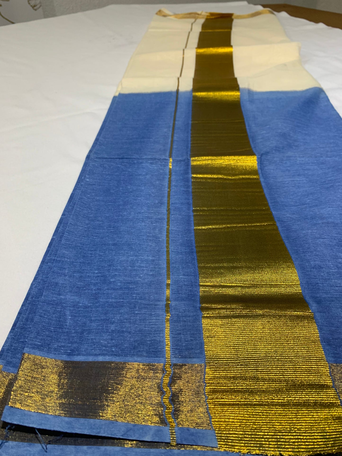 Golden kasavu saree with tie dye