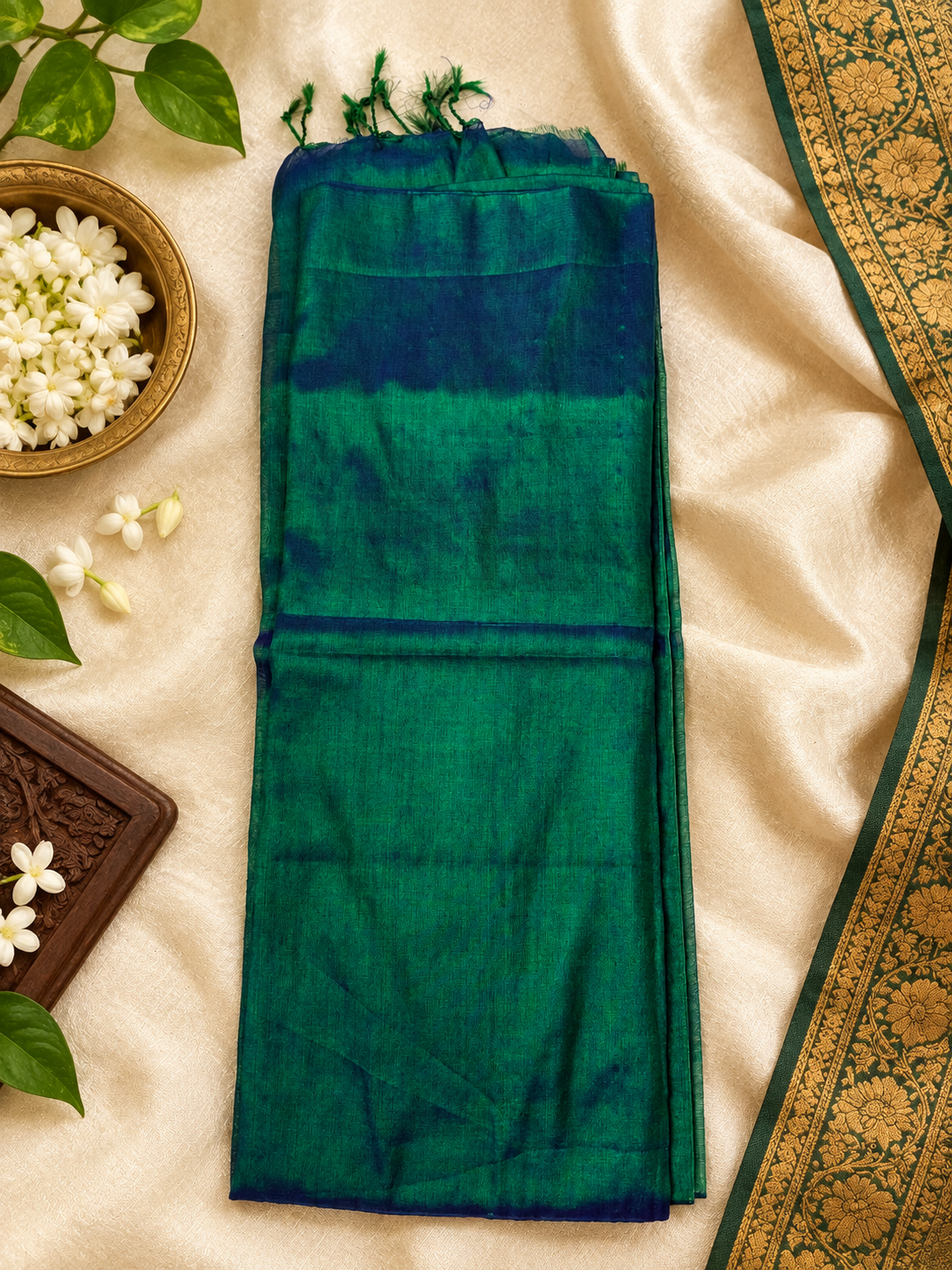 peacock green mul tissue saree