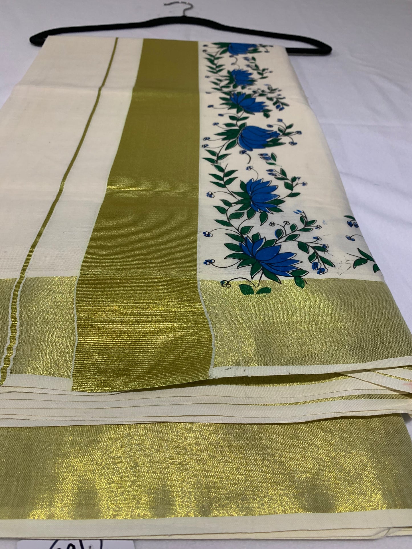 Golden kasavu saree with floral print