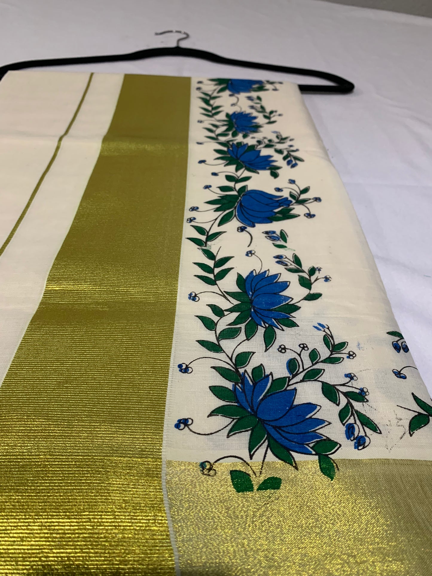 Golden kasavu saree with floral print